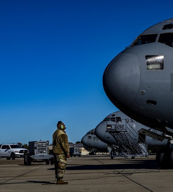 Aircrew member beside a transport aircraft during an aircraft maintenance operation